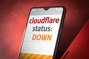 Smartphone displaying Cloudflare status as down on a mobile screen