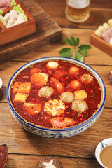 Hot Spicy Meatball Soup in Traditional Ceramic Bowl - Asian Hot Pot with Variety of Tasty Ingredients