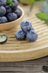 Fresh Blueberries with Water Drops on Wooden Board - Healthy Organic Fruit Still Life