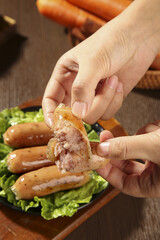 Gourmet Sausage Variety with Different Flavors and Meat Fillings on Wooden Board