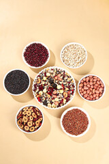 Variety of healthy cereals grains rice and legumes in bowls for nutritious breakfast and diet