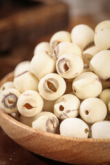 Dried White Lotus Seeds in Wooden Bowl - Traditional Asian Superfood Ingredients with Nutritional Health Benefits