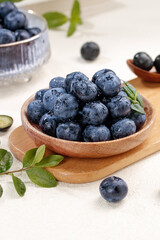 Fresh Blueberries in Wooden Bowl - Healthy Organic Fruit Still Life Photography