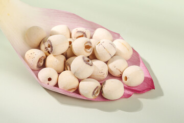 Dried Lotus Seeds with Removed Hearts on Pink Petal - Healthy Asian Superfood Ingredients for Traditional Cooking