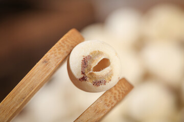 Fresh Lotus Seeds with Removed Red Core in Wooden Chopsticks - Nutritious Asian Cooking Ingredients