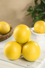 Fresh Yellow Citrus Fruits on White Cutting Board Kitchen Still Life