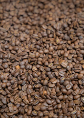 High-quality green and roasted coffee beans in close-up detail, premium Colombian coffee for export and specialty roasting
