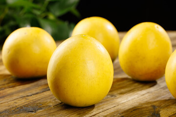 Fresh Yellow Plums on Wooden Table - Ripe Juicy Stone Fruit Close-up Detail