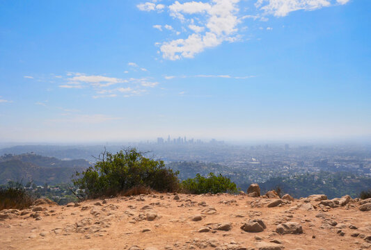 Skyline of Los Angeles as seen from the Wonder View Trailhead to Wisdom Tree on Cahuenga Peak during a summer season in Los Angeles, California, USA