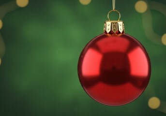 Red christmas ornament on a festive green bokeh backdrop