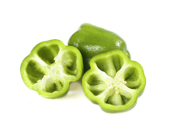 Fresh Green Bell Peppers Whole and Sliced on White Background