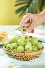 Fresh Green Fruit in Wicker Basket - Healthy Eating and Nutrition Concept