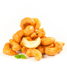 Fried Salted Cashew Nuts Pile with Mint Garnish on White Background