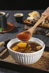 Chinese Herbal Soup with Corn Mushrooms Dates Wolfberries Traditional Medicine Ingredients Wooden Spoon