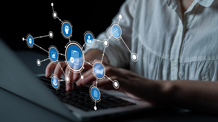 A close-up of hands typing on a laptop in a modern workspace, surrounded by digital icons that symbolize technology and communication in a connected world. Tessel