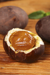 Chinese Salted Duck Eggs with Golden Yolk on Wooden Background