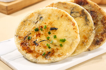 Traditional Chinese Savory Pancakes with Dried Vegetables and Scallions