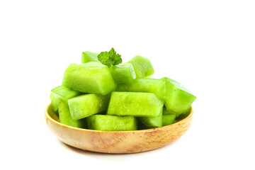 Fresh Green Melon Cubes with Mint in Wooden Bowl on White Background