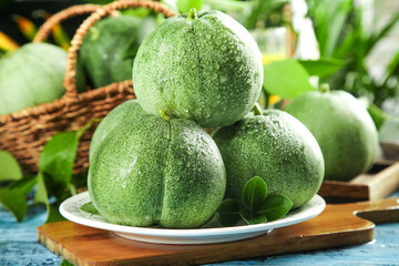 Fresh Green Shandong Melons with Water Droplets on White Plate - Organic Fruit Harvest