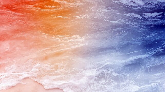 An abstract aerial view of ocean water, with a gradient transitioning from warm orange and pink hues on the left to deep blue and white on the right, depicting