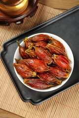 Dried Sichuan Gardenia Fruit in Bowl - Traditional Chinese Herbal Medicine Ingredient