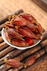 Dried Sichuan Gardenia Fruit Spice in Bowl - Traditional Chinese Cooking Ingredient