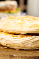 Fresh Puff Pastry Dough Layers on Wooden Board Ready for Baking