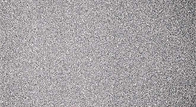 Black and white speckled texture with random small dark spots on light background pattern abstract