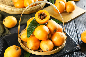 Fresh Yunnan Mountain Loquat Fruits in Wicker Basket - High Quality Asian Stone Fruit Display