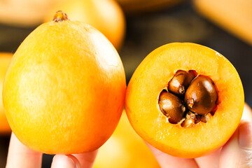 Fresh Loquat Fruit from Yunnan Mountains - Golden Asian Fruit with Seeds Exposed