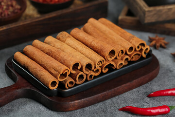 Natural Cinnamon Bark Sticks Traditional Guangxi Seasoning Spices on Wooden Tray