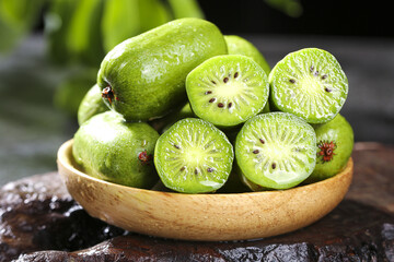 Fresh Kiwi Berries in Wooden Bowl - Delicious Vitamin Rich Healthy Fruit