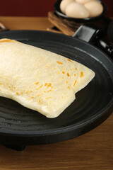 Ham and Egg Pancake Cooking in Non-Stick Pan with Golden Crust
