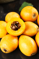 Fresh Loquat Fruits from Yunnan Mountains China - Sweet Tropical Fruit with Seeds Exposed