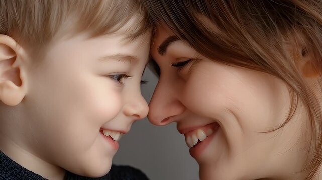 Woman and child touching noses close up portrait
