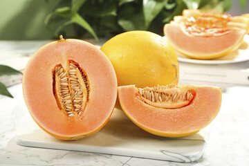 Fresh Yellow Honeydew Melons from Gansu China Sliced Open on Marble Board