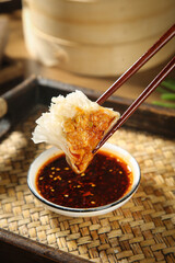 Traditional Asian Dumpling with Chopsticks and Soy Sauce - Authentic Chinese Dim Sum Cuisine
