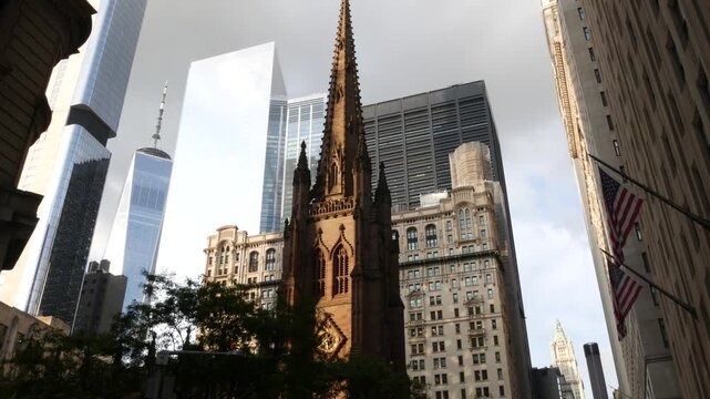 New York City Manhattan Downtown Financial District, United States of America. World Trade Center skyscraper, FiDi tower building. Modern business center and trinity church from Broadway. Christianity