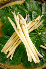 Fresh Lotus Root Vegetables on Green Leaves - Traditional Asian Produce from Honghu
