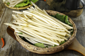 Fresh Lotus Root Stems Freshly Dug from Honghu Lake in Woven Basket Ready for Asian Cooking