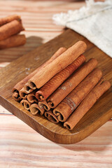 Guangxi Cinnamon Bark Sticks on Wooden Board - Natural Aromatic Spice Seasoning