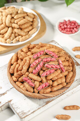 Fresh Peanuts in Shells and Shelled Red Skinned Peanuts in Wooden Bowls on White Rustic Background