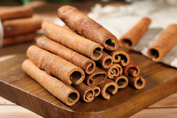 Natural Guangxi Cinnamon Bark Sticks on Wooden Board - Aromatic Spice Seasoning