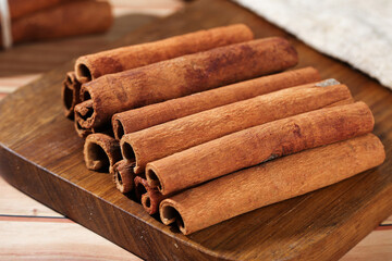 Natural Guangxi Cinnamon Sticks on Wooden Board - Premium Asian Spice Seasoning for Culinary Use