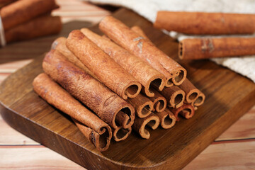Natural Cinnamon Bark Sticks from Guangxi China on Wooden Board - Premium Spice Ingredient