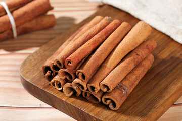 Fresh Guangxi Cinnamon Sticks Natural Spice Seasoning on Wooden Board Kitchen Cooking Ingredient