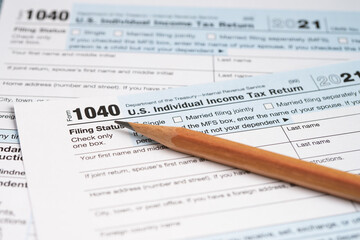 Tax Return form 1040 with pencil, U.S. Individual Income.