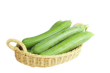 Fresh Shandong Loofah Gourds in Wicker Basket - Long Green Asian Vegetables on White Background