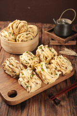 Handmade Pork Scallion Rolls on Wooden Board with Traditional Teapot Asian Cuisine Food Photography