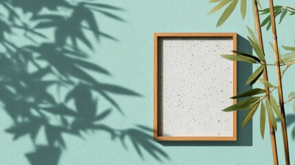Blank picture frame template on mint terrazzo background with bamboo shadows and clean lines